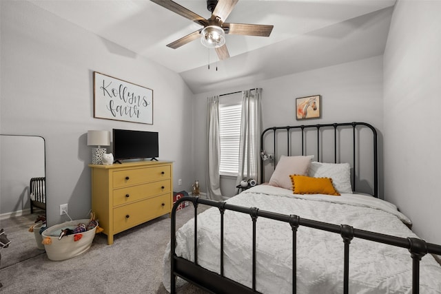 bedroom with a ceiling fan, lofted ceiling, and light carpet