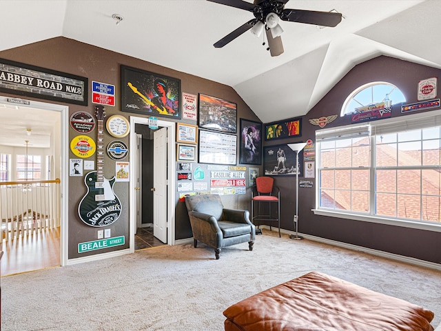 sitting room with lofted ceiling, ceiling fan, carpet floors, and baseboards