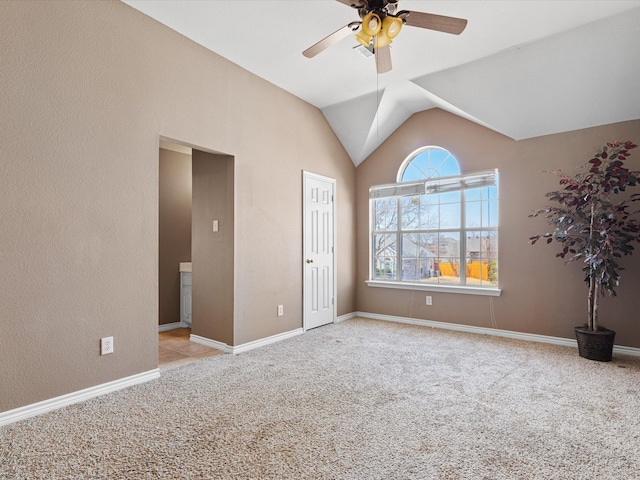 unfurnished bedroom featuring a ceiling fan, carpet, lofted ceiling, and baseboards