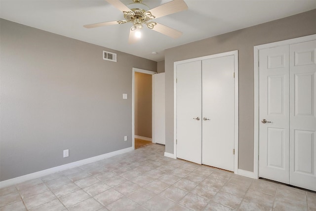 unfurnished bedroom featuring visible vents, ceiling fan, and baseboards