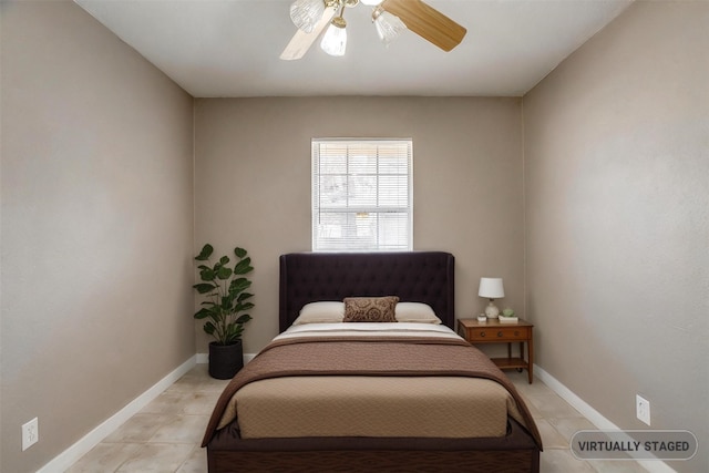 bedroom featuring ceiling fan, baseboards, and light tile patterned flooring