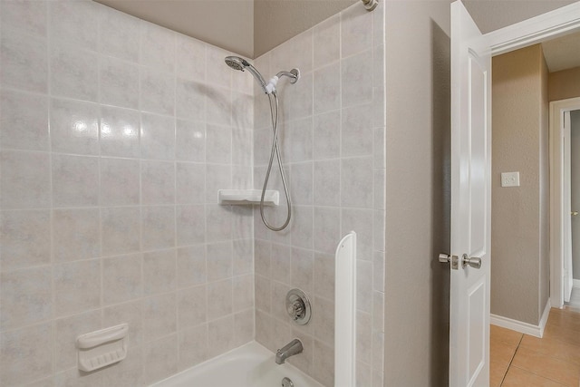 bathroom featuring  shower combination and tile patterned flooring