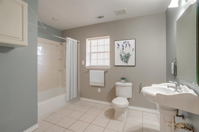 2013 Proctor Dr, Grand Prairie, TX 75051 - full bath featuring baseboards, tile patterned flooring, toilet, and visible vents