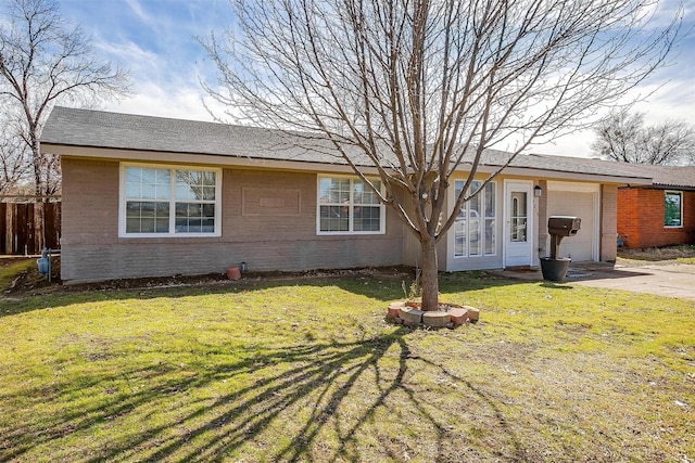 2013 Proctor Dr, Grand Prairie, TX 75051 - view of front of home with brick siding, a garage, a front lawn, and fence