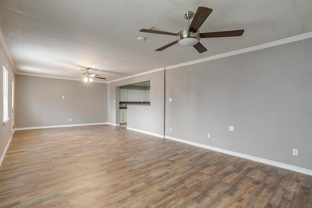 2013 Proctor Dr, Grand Prairie, TX 75051 - unfurnished living room with crown molding, ceiling fan, baseboards, and wood finished floors