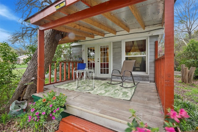 wooden deck featuring french doors