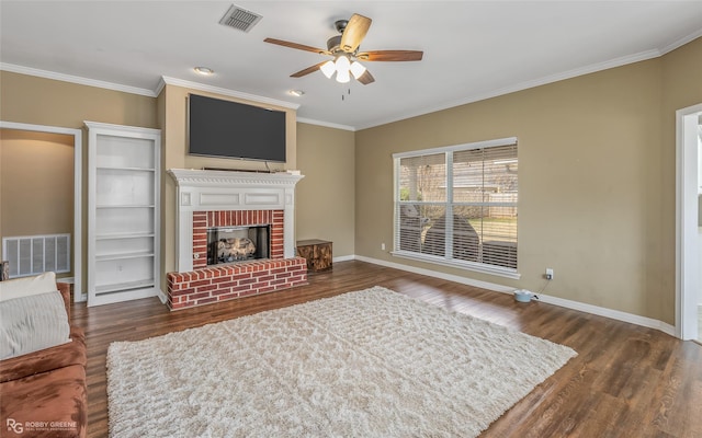 living room with visible vents, a fireplace, baseboards, and wood finished floors