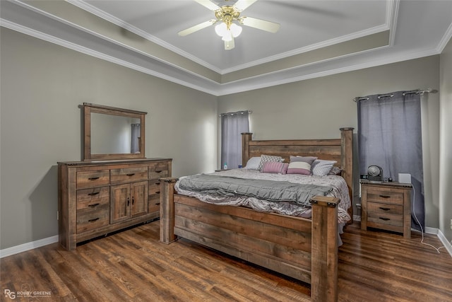 bedroom featuring crown molding, dark wood finished floors, baseboards, and a ceiling fan