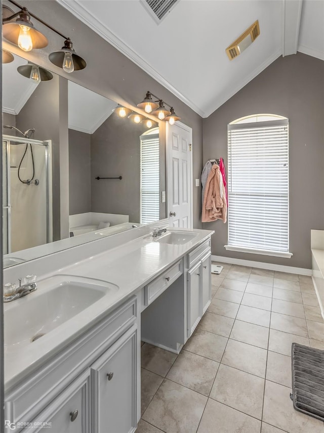 bathroom with lofted ceiling, tile patterned flooring, visible vents, and a sink