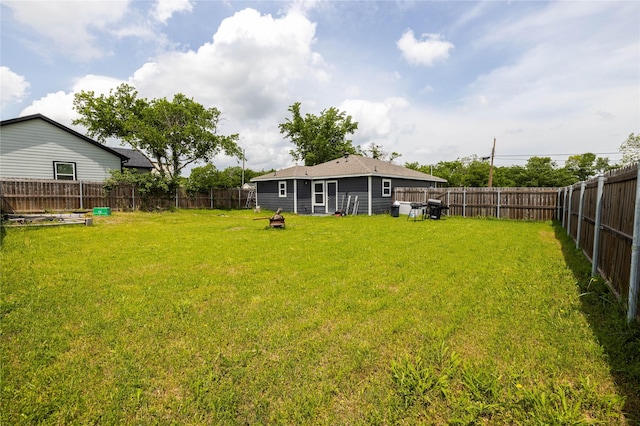 view of yard with a fenced backyard