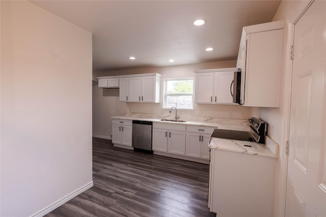 kitchen with baseboards, recessed lighting, stainless steel appliances, and a sink