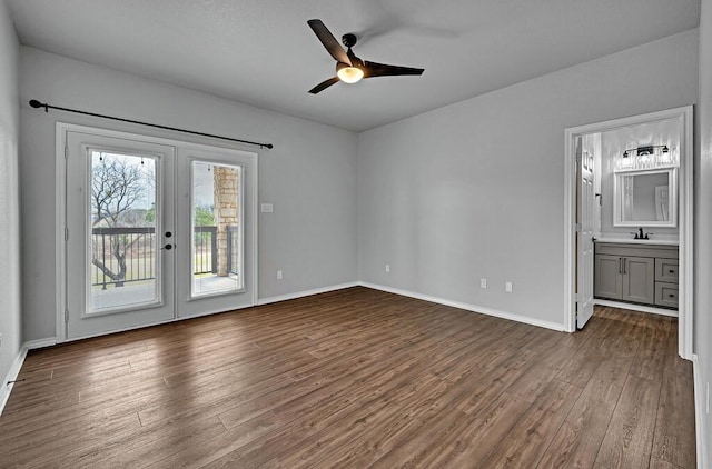 interior space featuring access to exterior, baseboards, dark wood-type flooring, and french doors