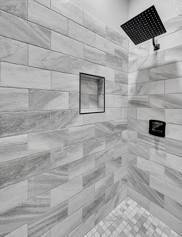 room details with a tile shower