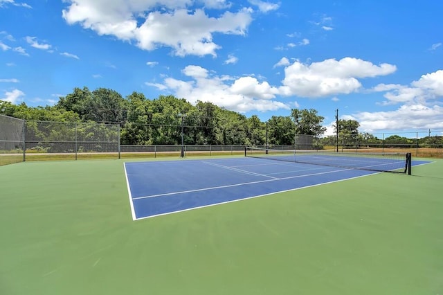 view of sport court with fence