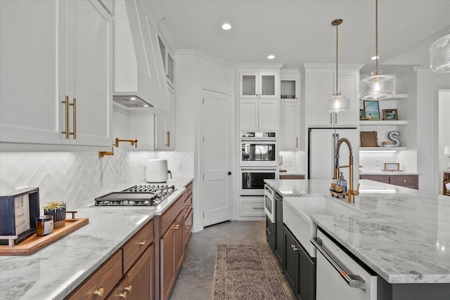1024 Todd St, Caddo Mills, TX 75135 - kitchen with double oven, stainless steel gas cooktop, a sink, white cabinetry, and custom exhaust hood