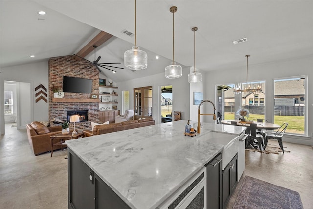 1024 Todd St, Caddo Mills, TX 75135 - kitchen with vaulted ceiling with beams, plenty of natural light, visible vents, and a fireplace