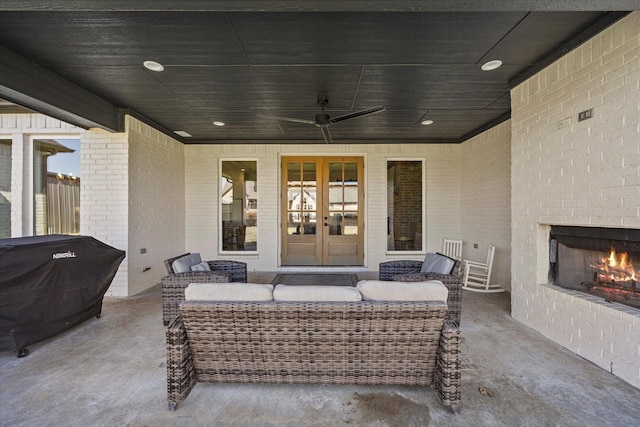 1024 Todd St, Caddo Mills, TX 75135 - view of patio with ceiling fan, an outdoor living space with a fireplace, grilling area, and french doors