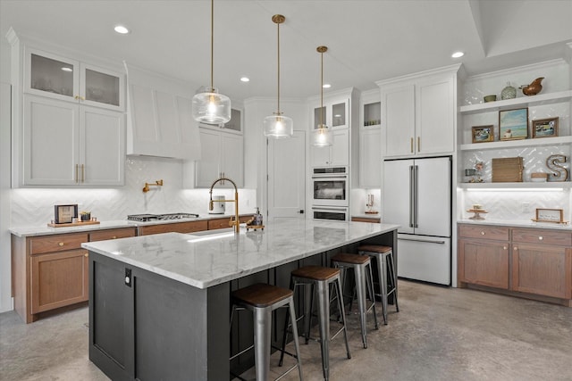 1024 Todd St, Caddo Mills, TX 75135 - kitchen featuring stainless steel gas cooktop, white double oven, glass insert cabinets, a sink, and high end refrigerator