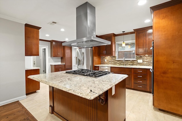 kitchen with stainless steel appliances, crown molding, decorative backsplash, and island range hood