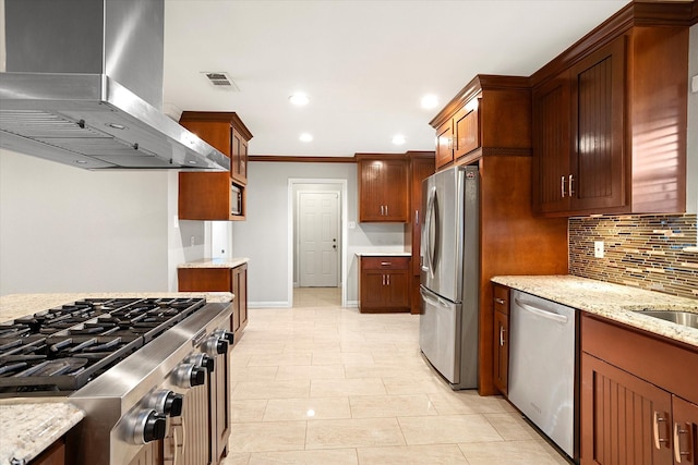 kitchen with light stone counters, stainless steel appliances, recessed lighting, backsplash, and wall chimney range hood