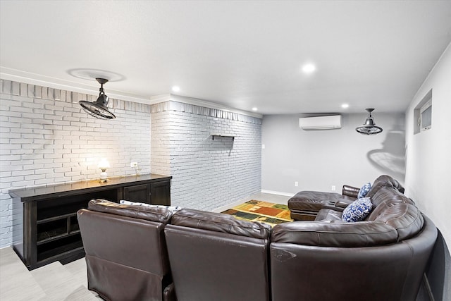 living room featuring recessed lighting, baseboards, brick wall, and a wall mounted AC