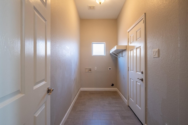 washroom with hookup for an electric dryer, laundry area, washer hookup, visible vents, and baseboards