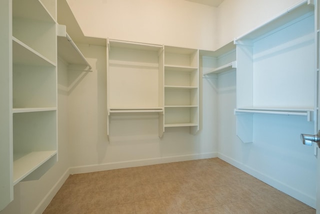 spacious closet featuring tile patterned floors