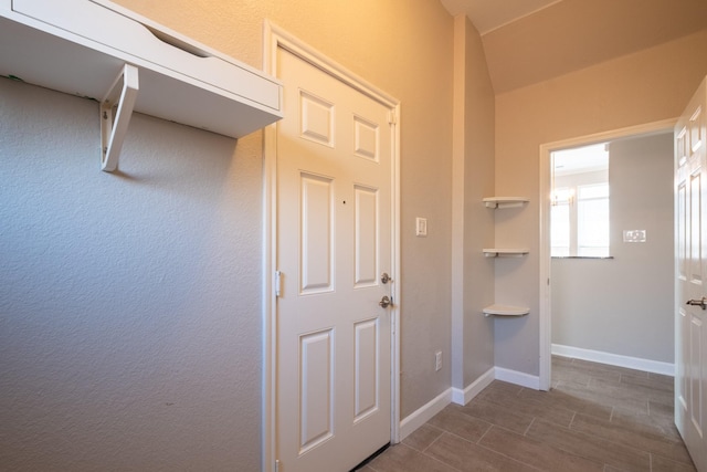 interior space featuring baseboards