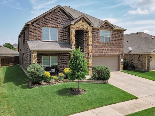 1009 Lake Forest Trl, Little Elm, TX 75068 - view of front of home featuring brick siding, a garage, concrete driveway, a shingled roof, and stone siding