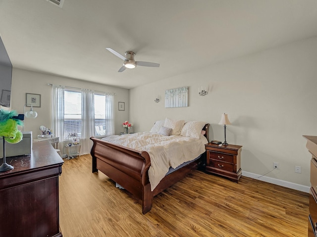 1009 Lake Forest Trl, Little Elm, TX 75068 - bedroom featuring wood finished floors, baseboards, and a ceiling fan