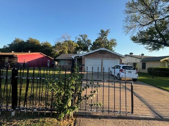 single story home featuring concrete driveway, a fenced front yard, and an attached garage