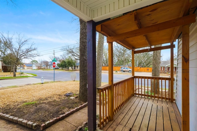 wooden terrace featuring covered porch