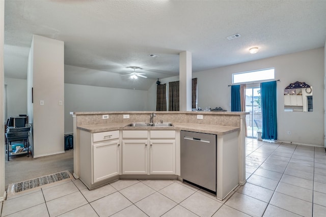 kitchen with visible vents, dishwasher, open floor plan, and a sink