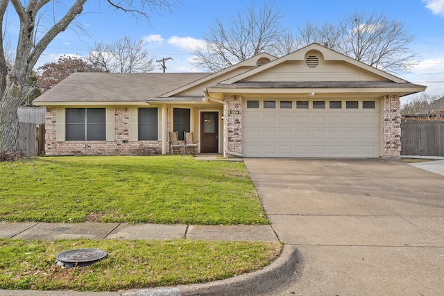 ranch-style house featuring driveway, an attached garage, fence, a front yard, and brick siding