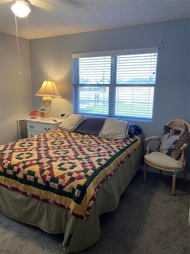 carpeted bedroom with a textured ceiling