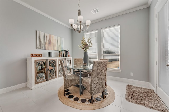 dining space with light tile patterned floors, baseboards, visible vents, and crown molding