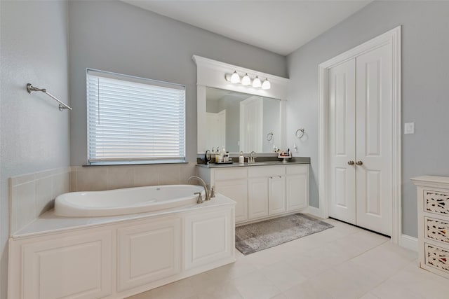 bathroom with a garden tub and vanity