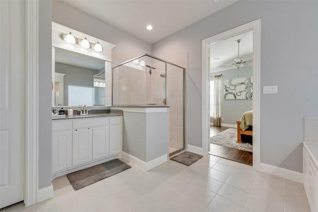 bathroom featuring a stall shower, ceiling fan, connected bathroom, vanity, and tile patterned floors