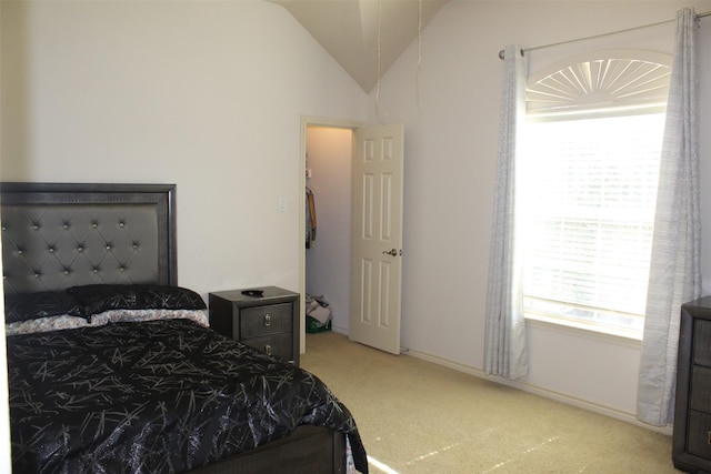 bedroom featuring lofted ceiling, baseboards, and light colored carpet