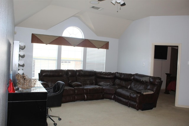 carpeted living area with lofted ceiling, visible vents, and a ceiling fan