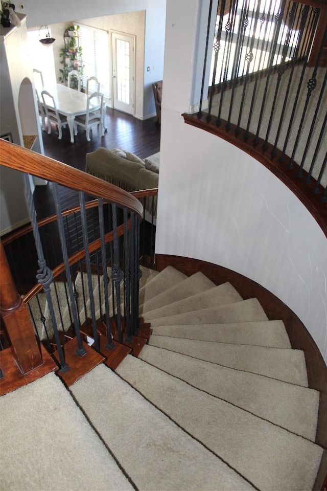 stairway with wood finished floors