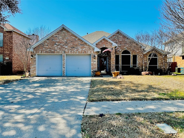 view of front of home featuring a garage, concrete driveway, brick siding, and central air condition unit