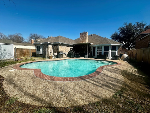 view of pool with a patio, a fenced backyard, and a fenced in pool