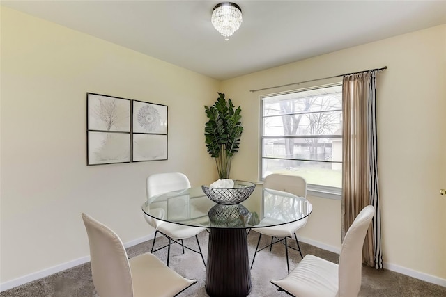 dining area with carpet and baseboards