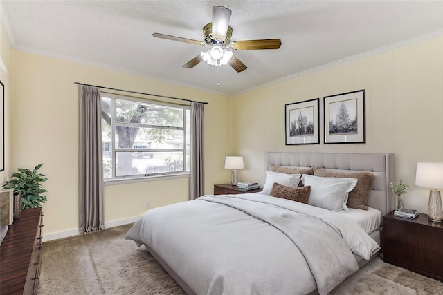 bedroom featuring ornamental molding, carpet flooring, baseboards, and a ceiling fan