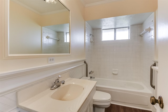 full bath with toilet, ornamental molding, wood finished floors, vanity, and shower / washtub combination