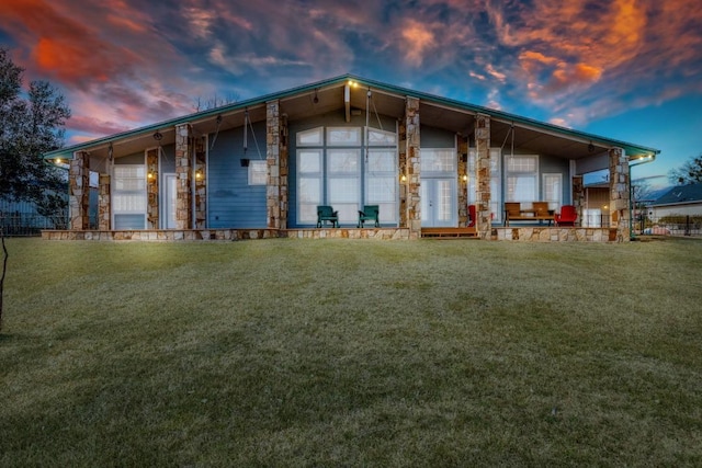 view of front facade featuring a porch and a lawn