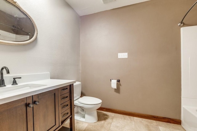 full bathroom featuring vanity, toilet, and baseboards