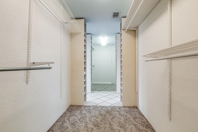 spacious closet with carpet and visible vents