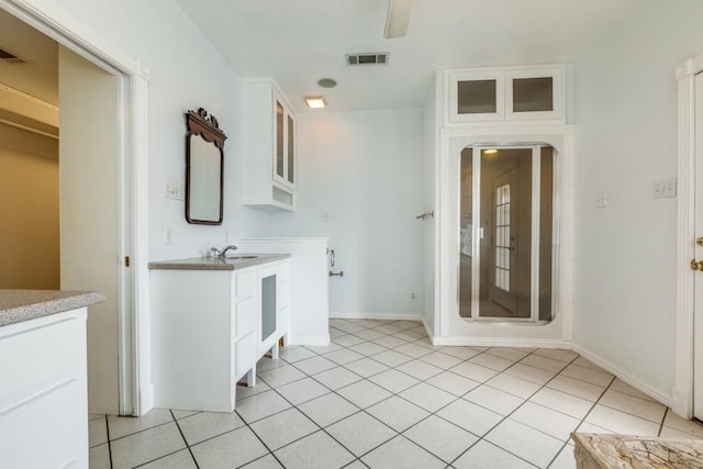 full bathroom with visible vents, vanity, baseboards, and tile patterned floors